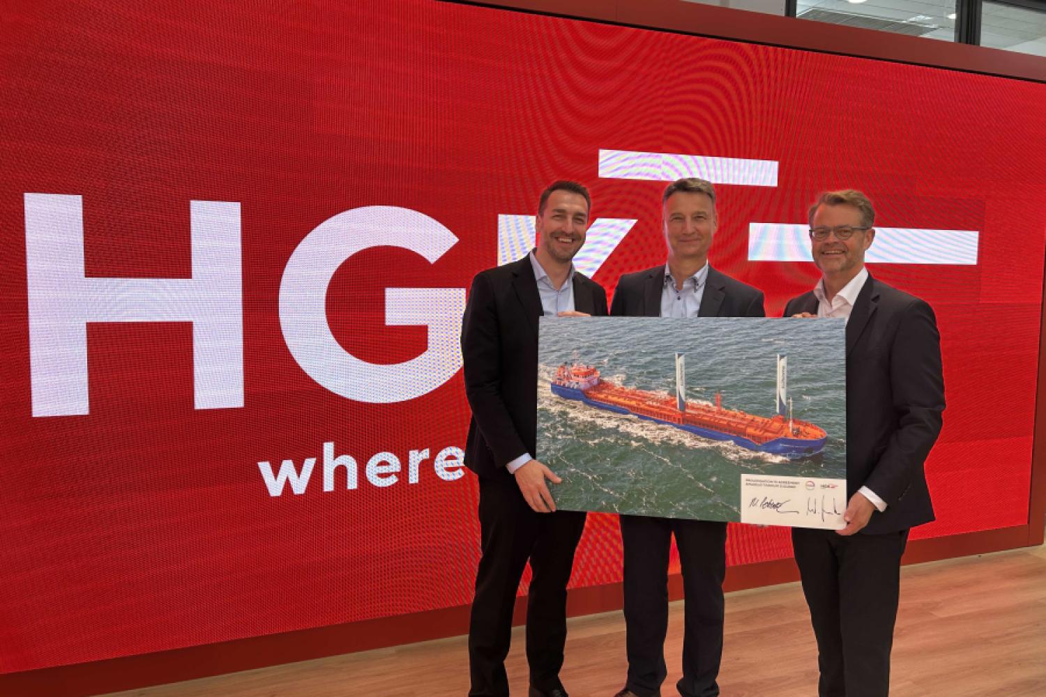 Continue their collaboration for resource-conserving transport logistics in coastal waters until 2040. From left to right: Steffen Bauer, CEO of HGK Shipping, Nils Peterzelka, working as Sourcing Manager Regional Bulk Shipping in Logistics Procurement at Covestro, and Wolfgang Nowak, Managing Director of Amadeus Schiffahrts- und Speditions GmbH, in Munich at the sidelines of the contract signing at transport logistic in June 2025. (Image: HGK Shipping