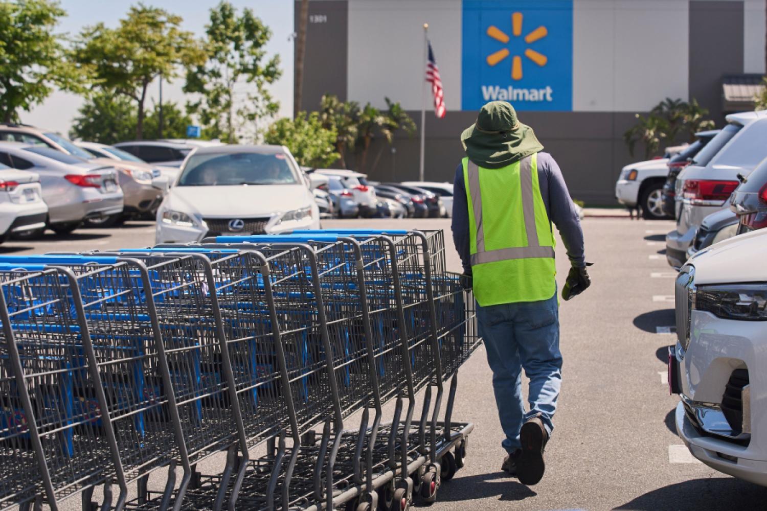 Empty shopping carts are collected in the parking lot of a Walmart market in Burbank, California, in April. (Photo: Damian Dovarganes/AP/dpa)